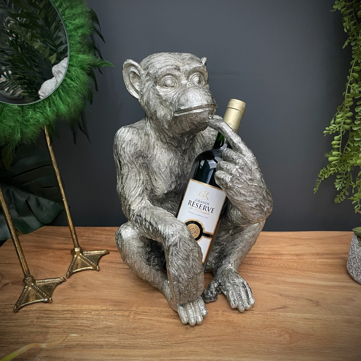 Monkey holding wine bottle hotsell
